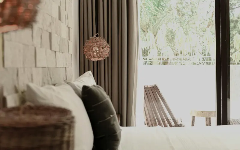 Bedroom with a textured wall and a window
