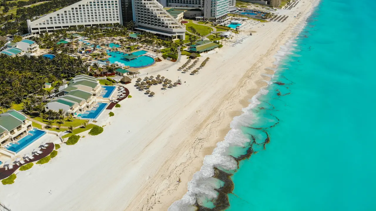 Aerial view of the Cancún Hotel Zone with white sand and turquoise sea